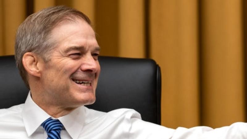WASHINGTON, DC - MAY 16: Chairman Rep. Jim Jordan (R-OH) smiles while chatting with Rep. Adam Schiff (D-CA) and Rep. Glenn Ivey (D-MD) before the start of a House Judiciary Committee markup